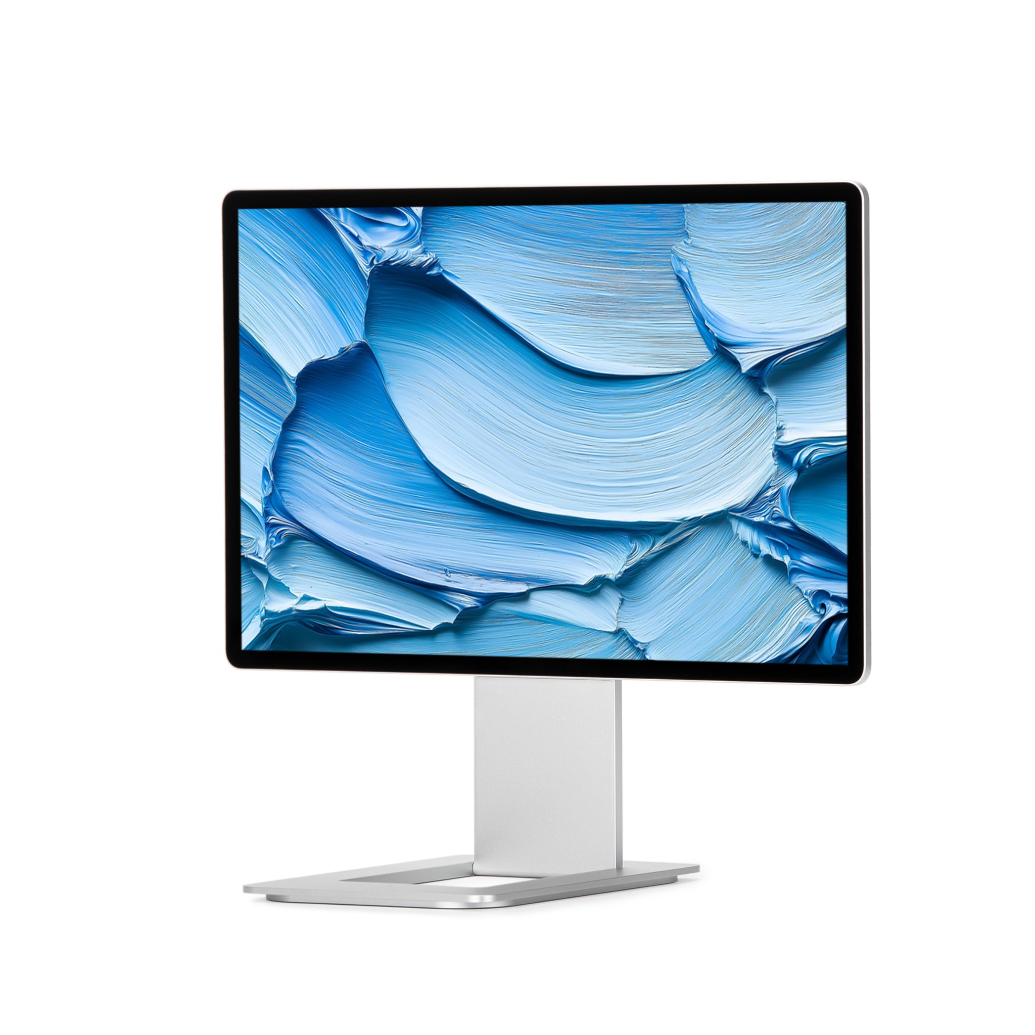 Elite 16" set up alongside a laptop on a desk